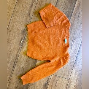 Molly Bracken stylish sweater in a dark/burnt orange color.